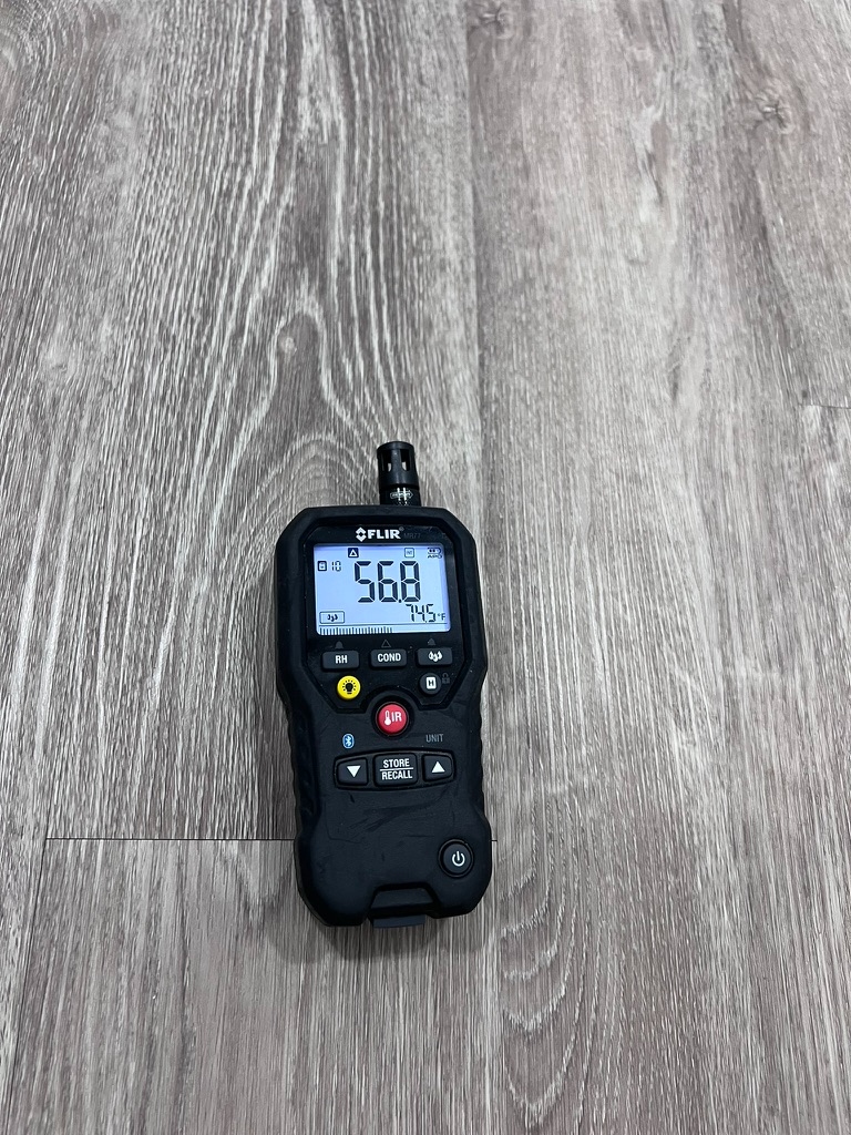 FLIR moisture meter confirming elevated readings in Hialeah, FL