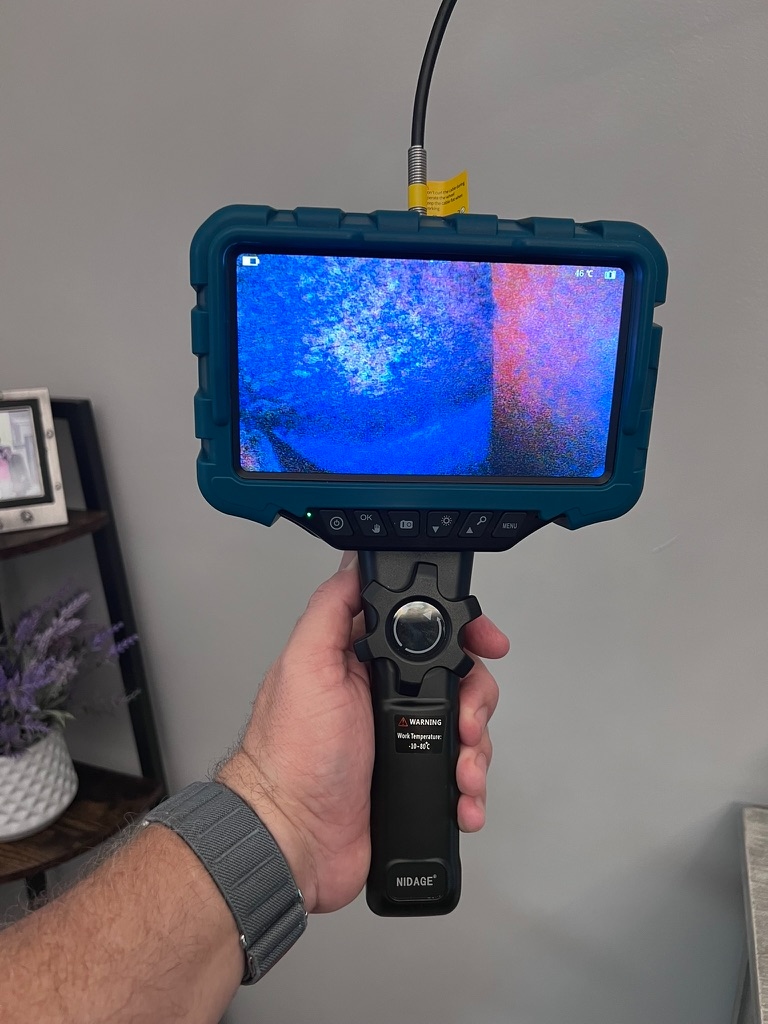 Thermal imaging camera scanning for hidden moisture in Hialeah property