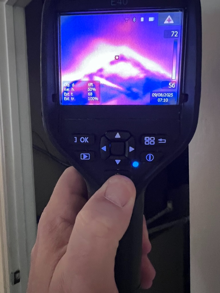 FLIR E40 thermal imaging camera showing a 72 degree reading at a wall angle during a mold investigation