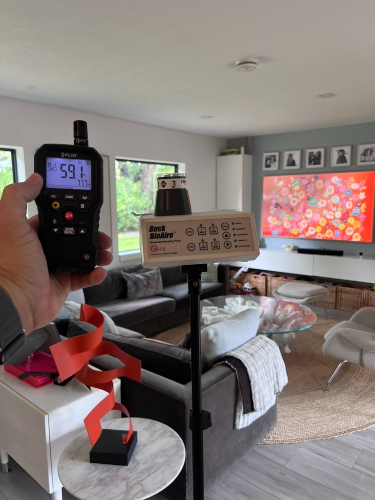 Air quality monitor and bioaerosol sampling pump in use