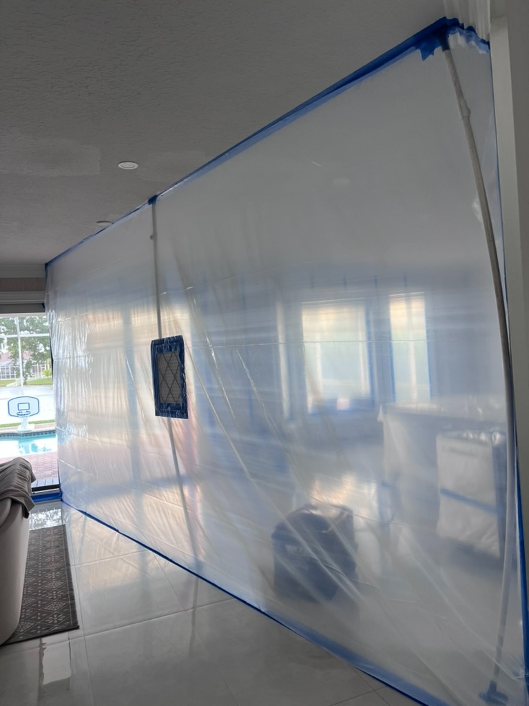 Containment plastic sheeting installed during post remediation verification