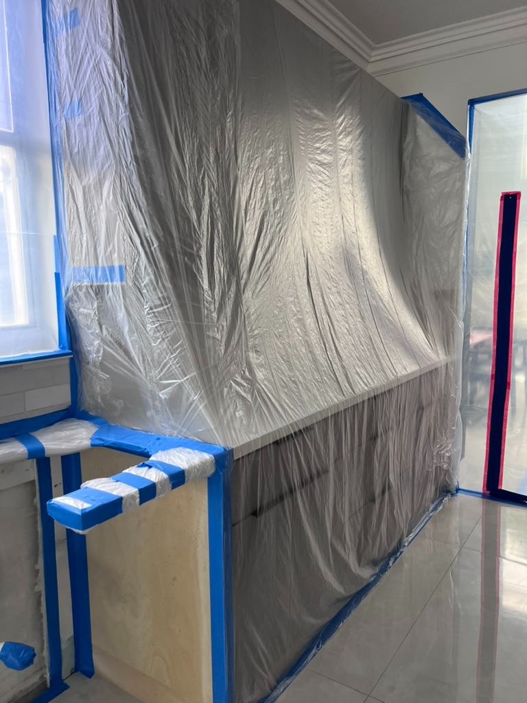 Kitchen remediation with covered counters and containment barrier