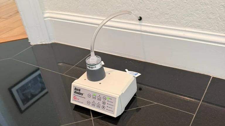 Wall cavity sampling pump with collection tube entering a small wall access hole